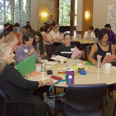 Seated audience listening to presentation