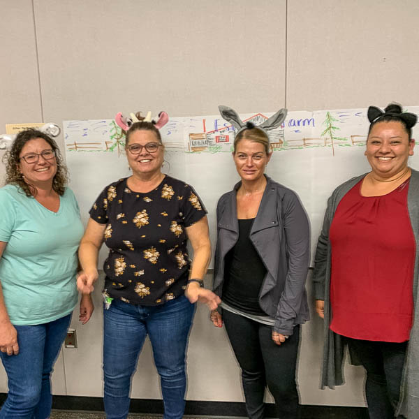 Group of participants posing in silly hats